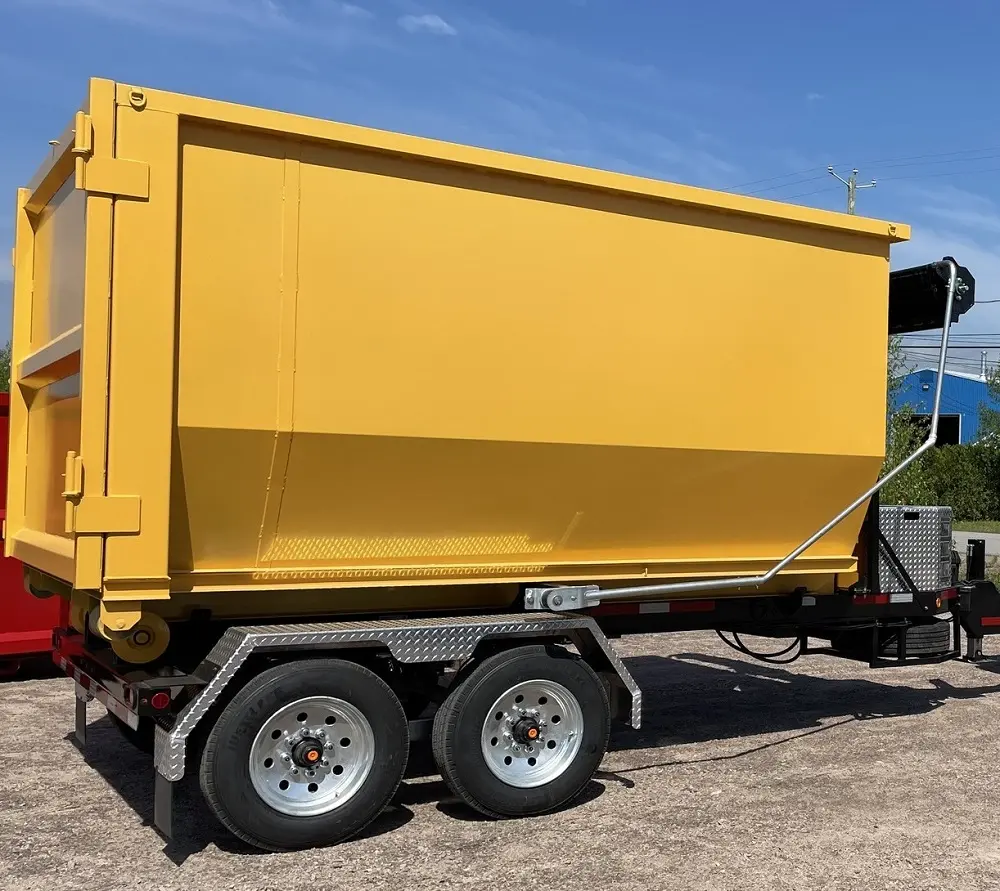 Georgiana Settlement roll-off dumpster is secured on a dual-axle trailer for rental service captured by Space Coast Dumpster Rental