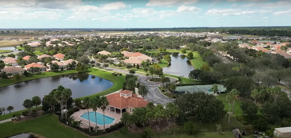 Palm Bay neighborhoods with lakes and curved streets captured in an aerial image by Space Coast Dumpster Rental