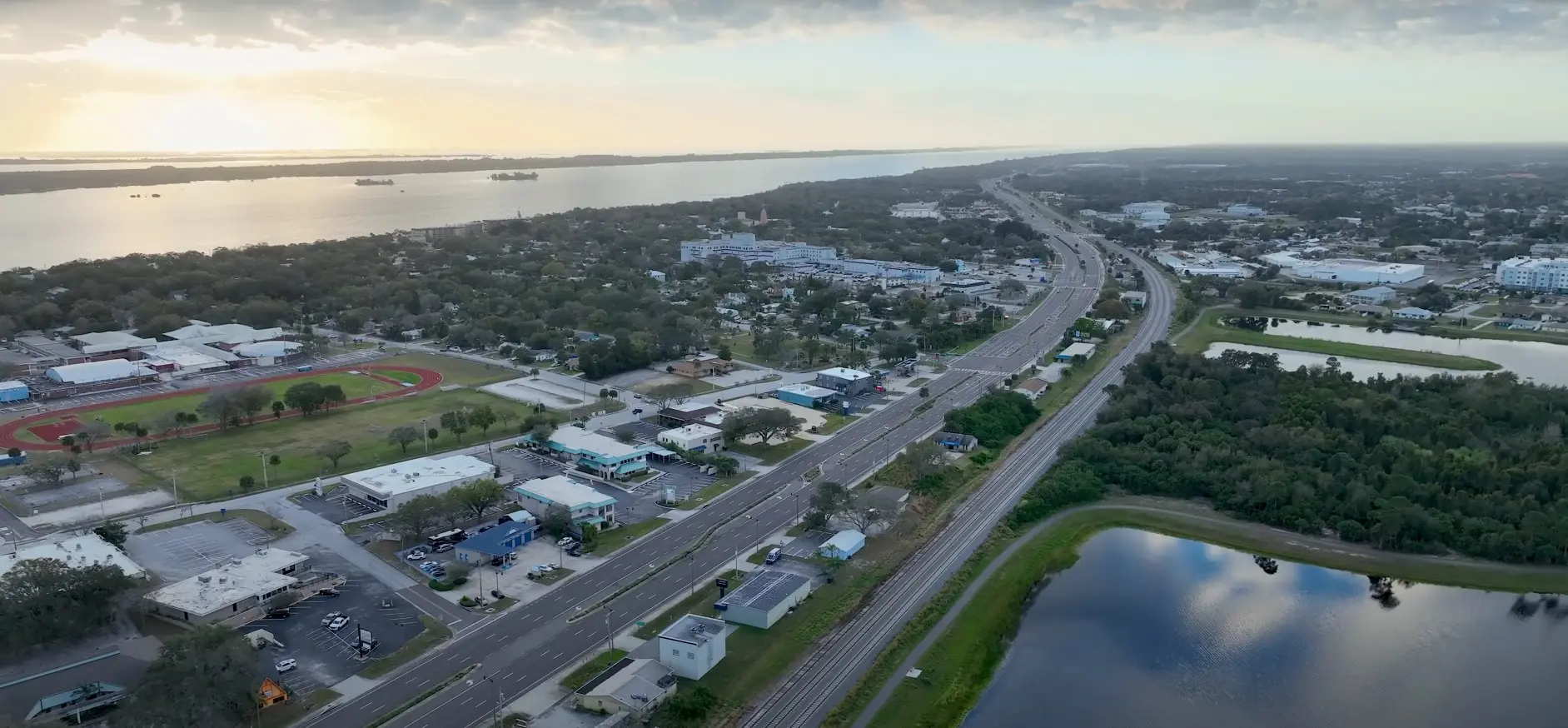 Rockledge captures a sprawling view of commercial rooftops and a curving highway beside the Indian River, photographed by Space Coast Dumpster Rental