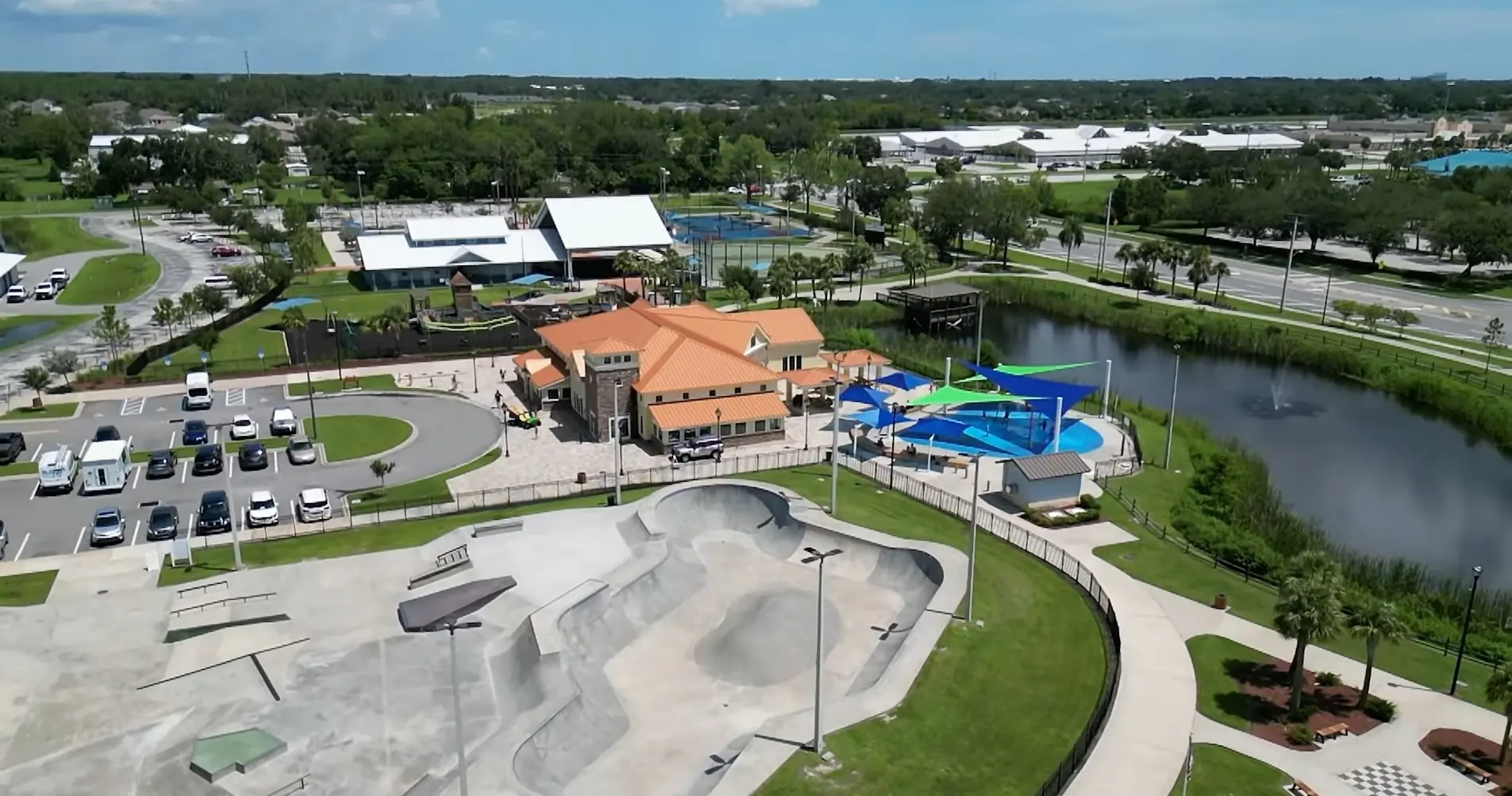 West Melbourne showcases a vibrant civic park with a concrete skate bowl, aquatic splash zone, and parking lot, captured by Space Coast Dumpster Rental